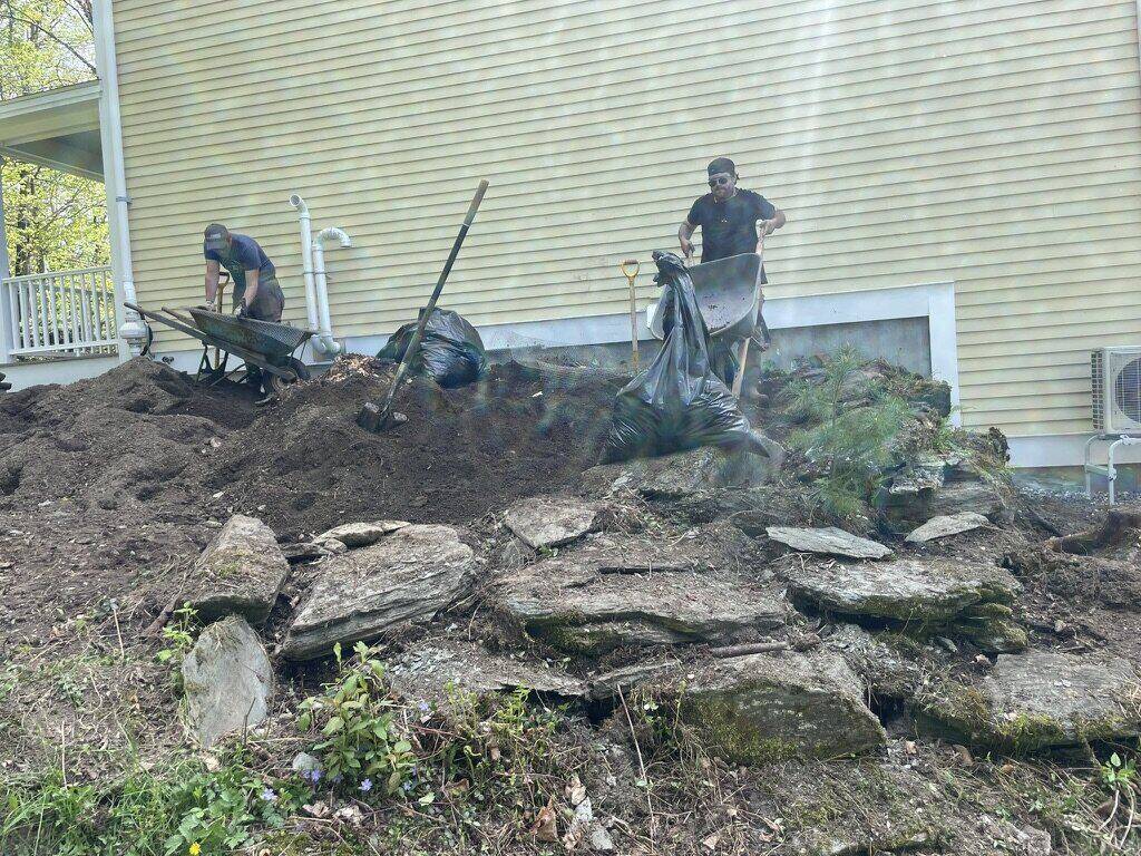 Crew clearing and hauling out the overgrowth